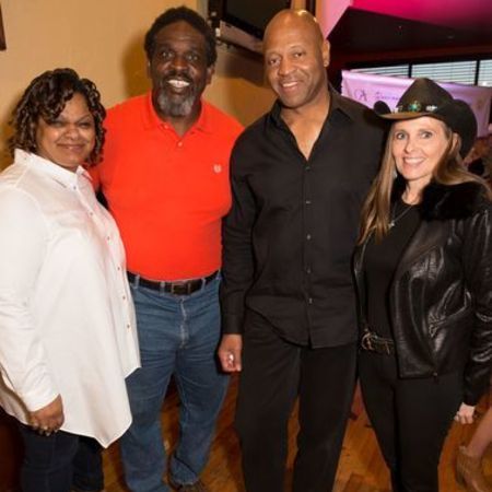 Nate's wife and their friends posing for a picture